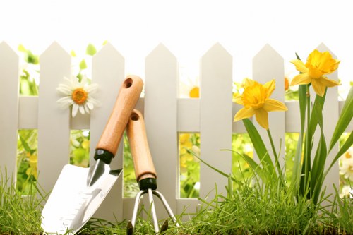 Expert landscaper maintaining a garden in Hanwell